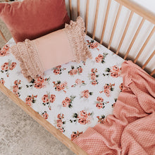 Load image into Gallery viewer, Snuggle Hunny Kids Rosebud Fitted Cot Sheet shown on a cot bed with throw and pillows on top