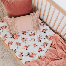 Load image into Gallery viewer, Snuggle Hunny Kids Rosebud Fitted Cot Sheet shown on a cot bed with throw and pillows on top