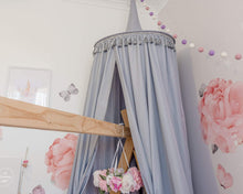 Load image into Gallery viewer, Grey canopy hanging over timber house bed with pink wall decals and floral mobile