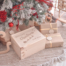 Load image into Gallery viewer, Timber christmas eve box sitting under christmas tree decorated in read and white decorations. Sitting next to presents wrapped in brown paper. 