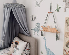 Load image into Gallery viewer, grey canopy hanging above bed in boys dinosaur themed bedroom. dinosaur wall decals and bedding 