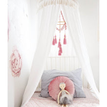 Load image into Gallery viewer, A girls room with white round canopy hanging over white bed with boho dream catcher and nana huchy doll on bed with a pink velvet cushion