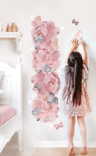 Load image into Gallery viewer, girl standing next to removable wall decal growth hiehgt chart made of pink peonies and purple butterflies