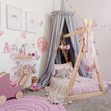 Load image into Gallery viewer, Grey round canopy over timber frame bed and rose decals on wall with wooden toys around the room and pink crochet rug on floor