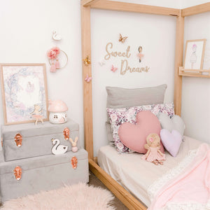 grey storage cases in girls bedroom 