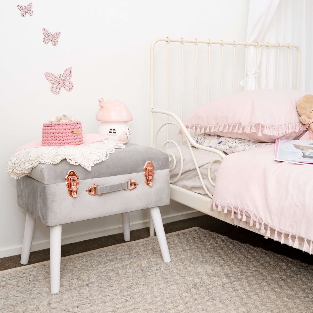 Light grey stool in girls bedroom