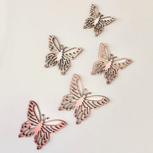 Load image into Gallery viewer, Five pink timber butterflies in various sizes attached to wall.