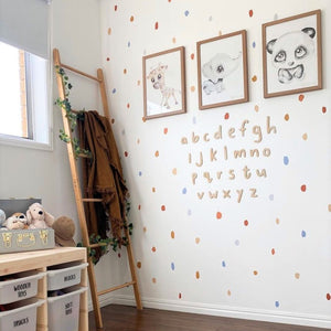 Timber alphabet on wall with wall decals and three picture frames