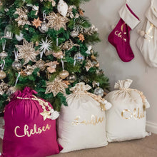 Load image into Gallery viewer, purple and ivory santa sacks sitting under a christmas tree with gold decorations