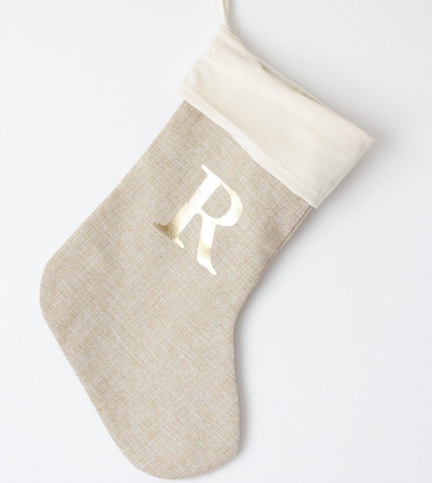 natural colour christmas stocking personalised with the letter R in gold font