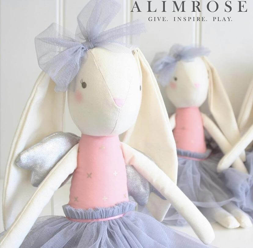 two pink and grey fabric bunnies with silver wings and embroided face