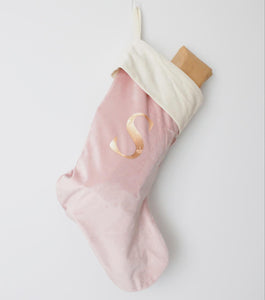 Blush pink velvet christmas stocking personalised with the letter S in rose gold metallic font