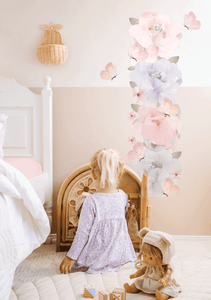 removable wall decal height chart on kids bedroom wall with blonde girl playing with doll house and doll on the floor