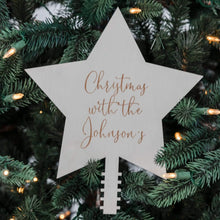 Load image into Gallery viewer, persoanlised timber star tree topper hanging on a green christmas tree with the words christmas with the johnson&#39;s 