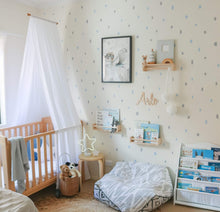 Load image into Gallery viewer, picture of white drape canopy hanging about timber cot in boys blue nursery