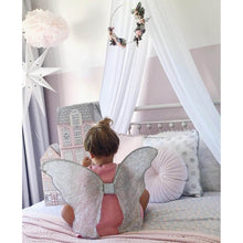 Load image into Gallery viewer, white drape canopy hanging above single bed with girls sitting on bed wearing silver angel wings